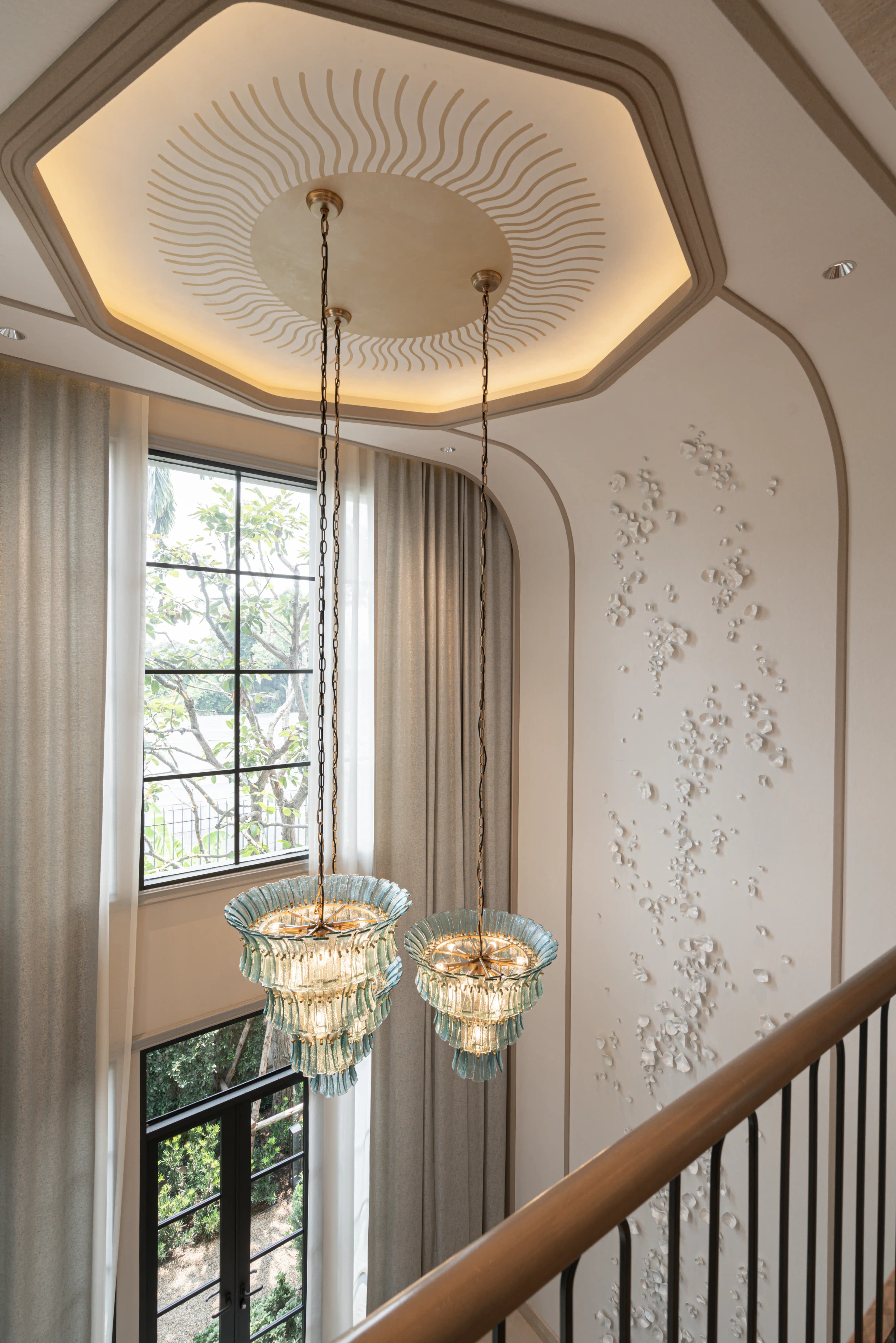 Sculptural lighting in a double-height residential interior