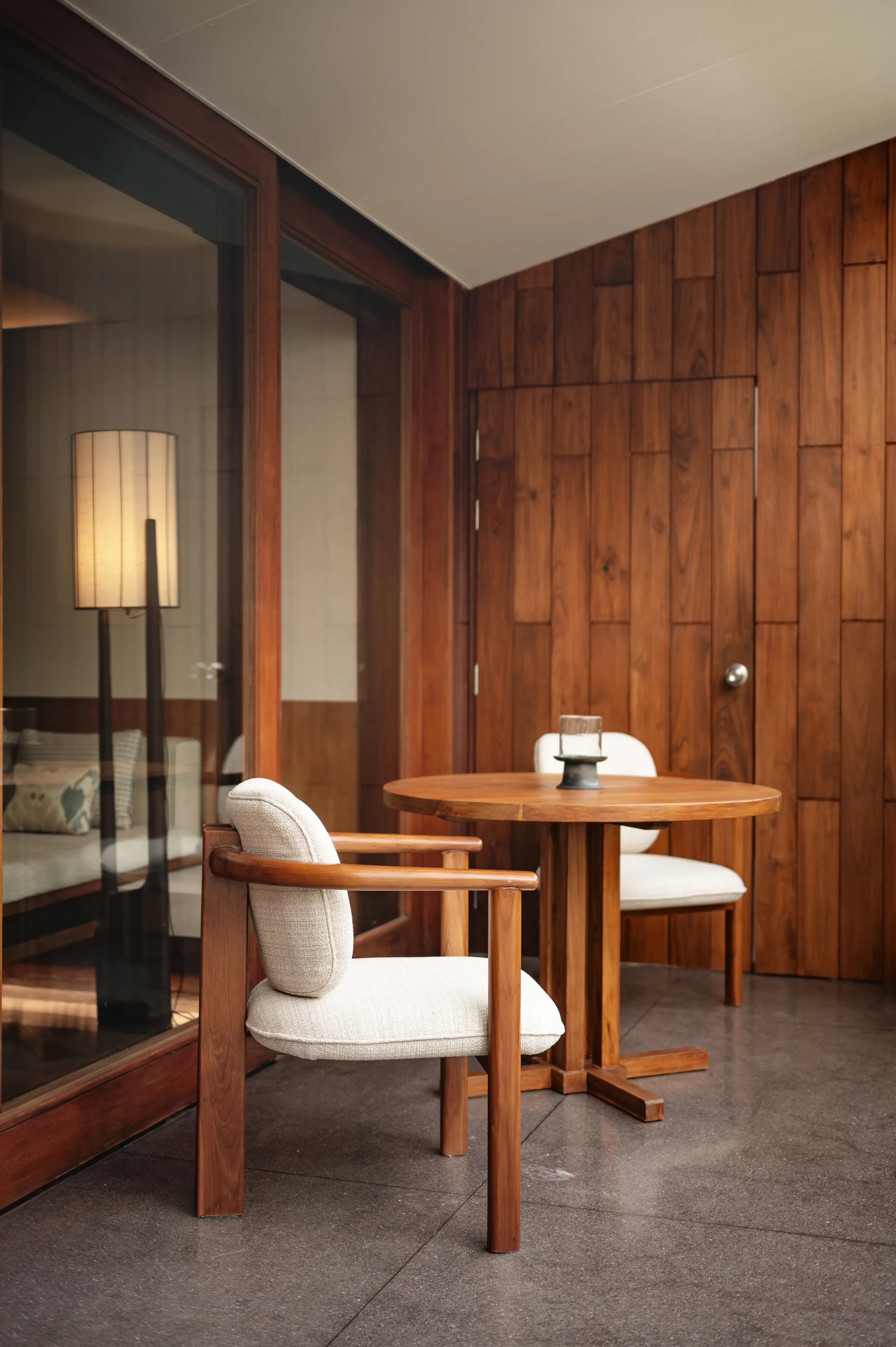 Layered timber, textiles, and ambient lighting in a hotel guest room