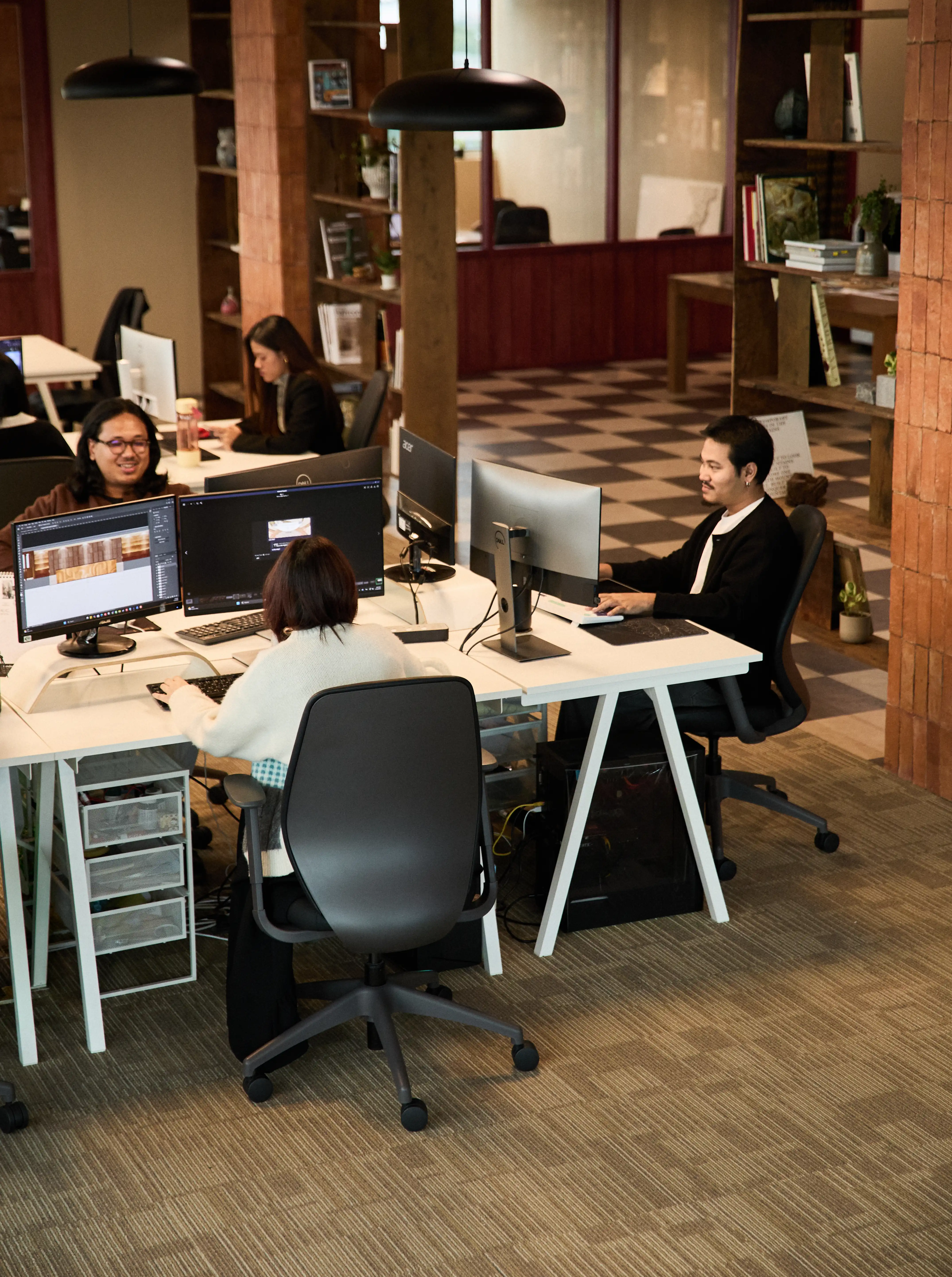 Designer working at workstation desk