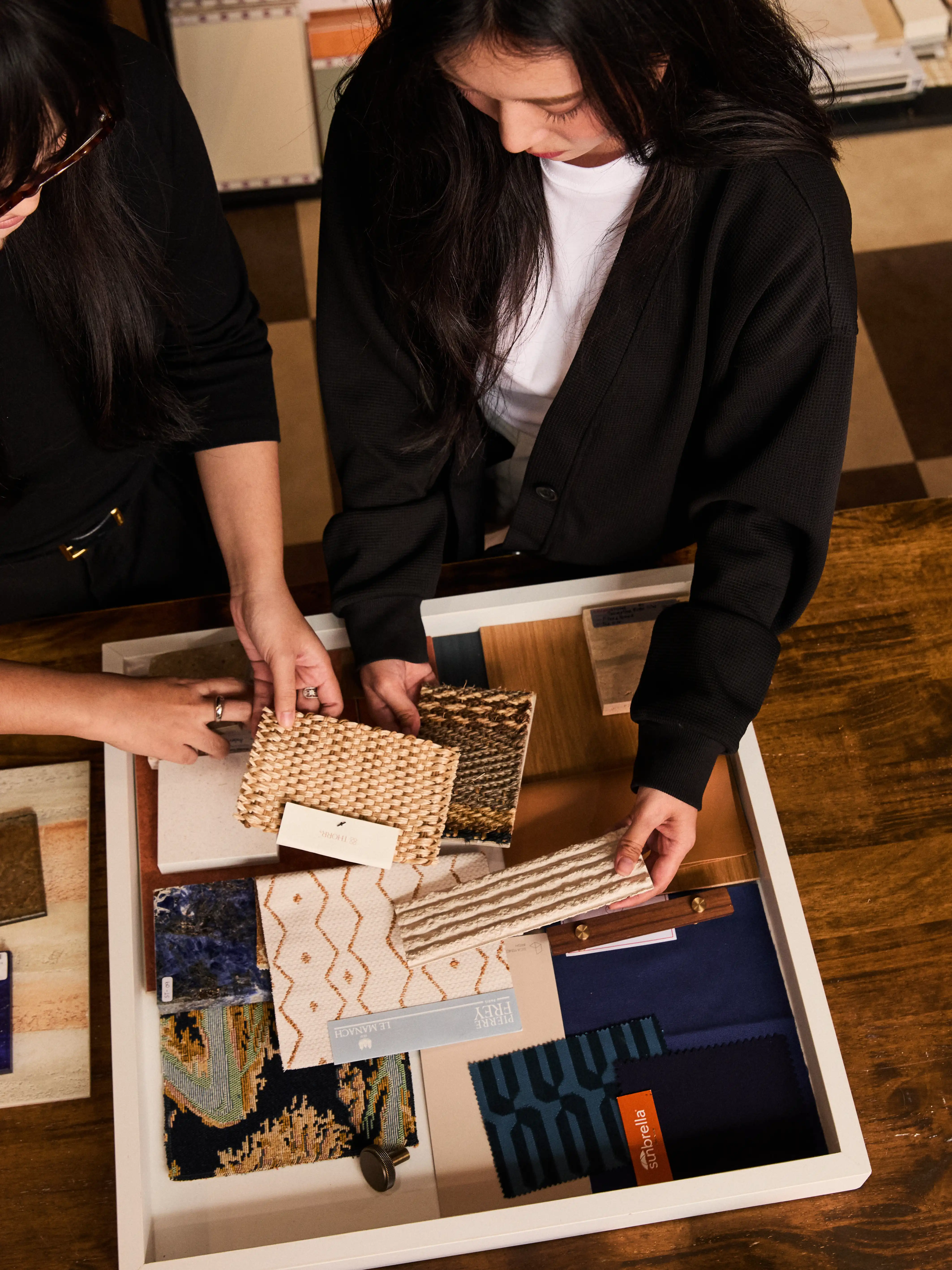 Designers selecting material palette swatches